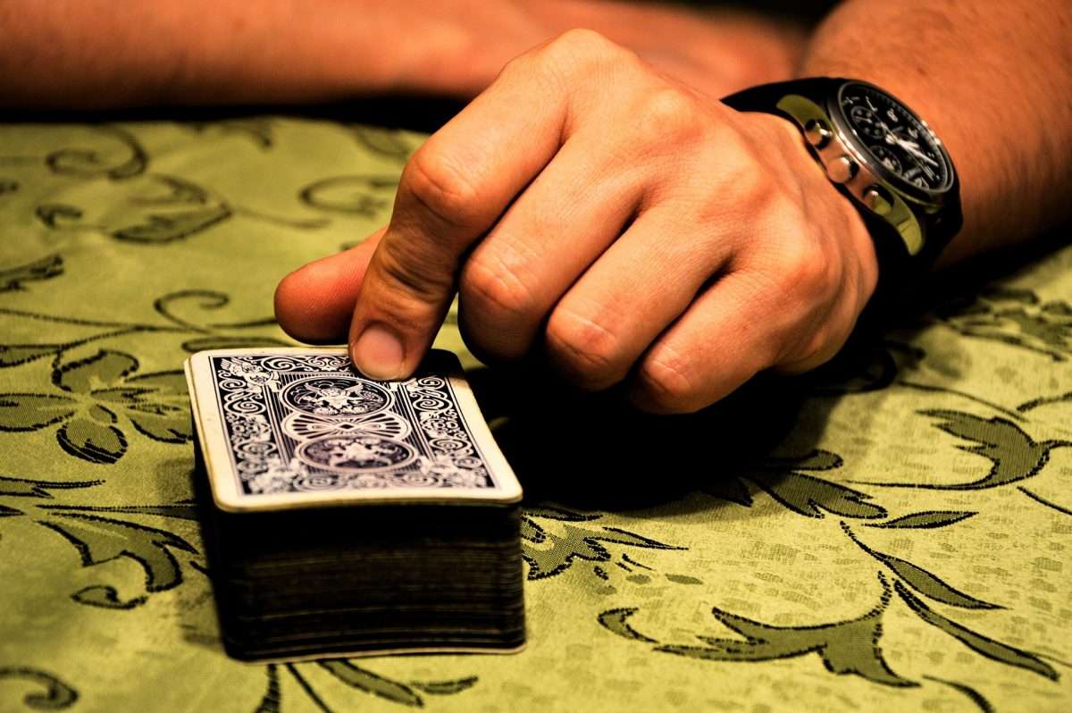 blackjack playing cards on dealer table